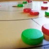 Crokinole 78: Spielsteine rot + grün je 12 Stück